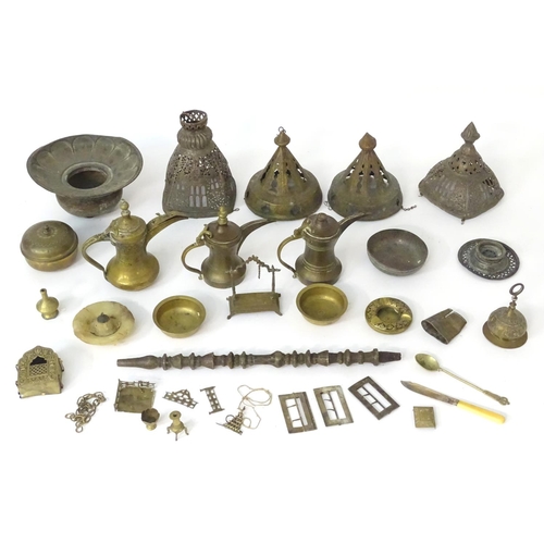 1039 - An assortment of Eastern metalware, including teapots, dishes, pendant lamp shades, various shisha p... 