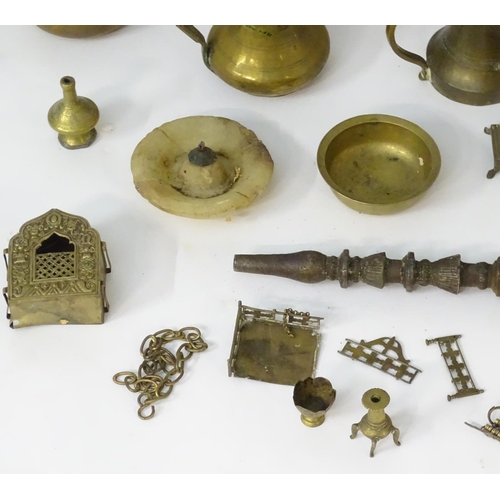 1039 - An assortment of Eastern metalware, including teapots, dishes, pendant lamp shades, various shisha p... 