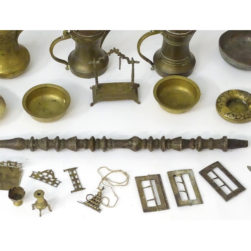 1039 - An assortment of Eastern metalware, including teapots, dishes, pendant lamp shades, various shisha p... 