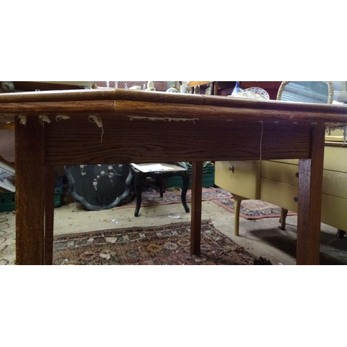 187 - An oak octagonal dining table. Approx. 46