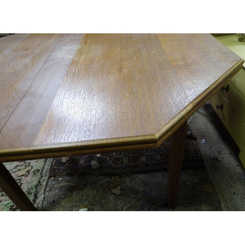 187 - An oak octagonal dining table. Approx. 46
