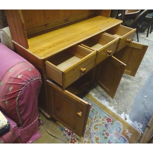191 - A late 20thC pine dresser. Approx. 69 1/4