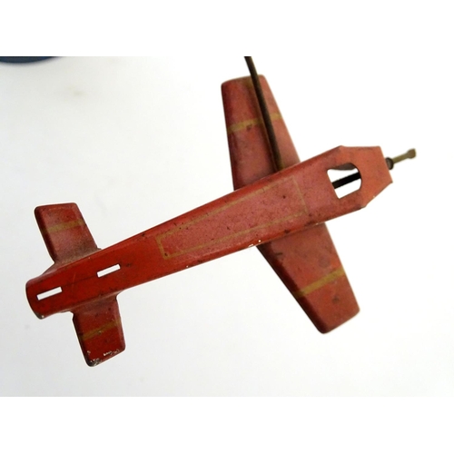 205 - Toys: An early 20thC tin plate Tower Aeroplane / airplane by Louis Marx & Co. Approx. 8 1/2