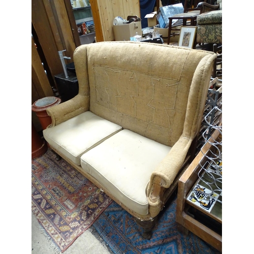211 - A wing back sofa for restoration. Approx. 60