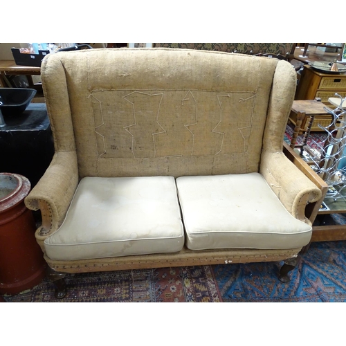211 - A wing back sofa for restoration. Approx. 60