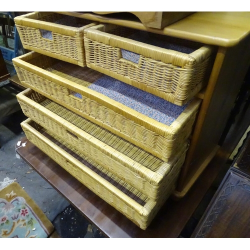 216 - A pine unit with wicker drawers, two over three, together with small pine low cupboard. The largest ... 