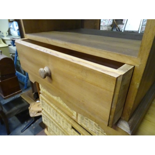216 - A pine unit with wicker drawers, two over three, together with small pine low cupboard. The largest ... 