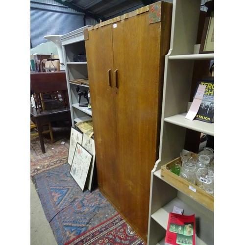 220 - A 2 door light oak wardrobe by E. Gomme. Approx. 70