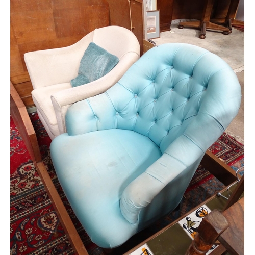 224 - Two low upholstered armchairs. Largest approx. 33