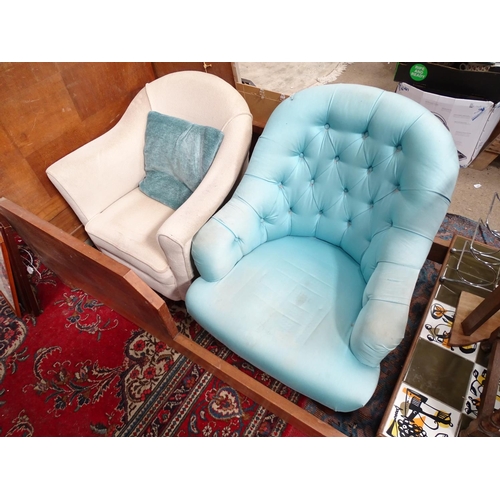 224 - Two low upholstered armchairs. Largest approx. 33
