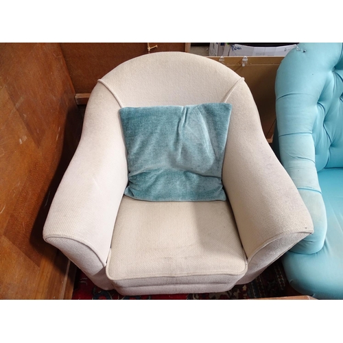224 - Two low upholstered armchairs. Largest approx. 33