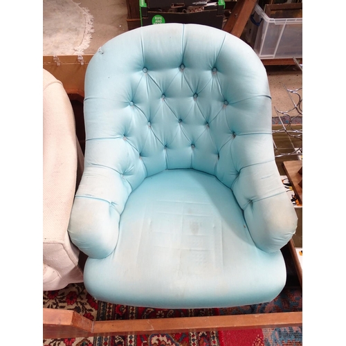 224 - Two low upholstered armchairs. Largest approx. 33