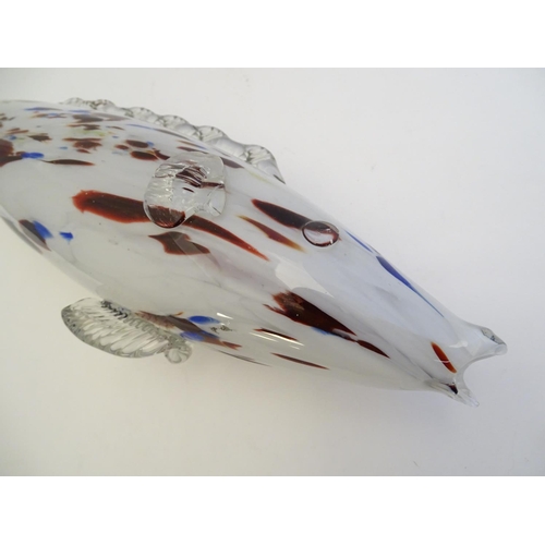 192 - A Murano glass model of a fish, decorated in white with red and blue flecks. 18 1/4