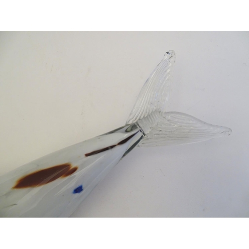 192 - A Murano glass model of a fish, decorated in white with red and blue flecks. 18 1/4