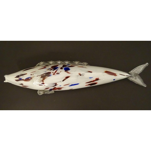 192 - A Murano glass model of a fish, decorated in white with red and blue flecks. 18 1/4