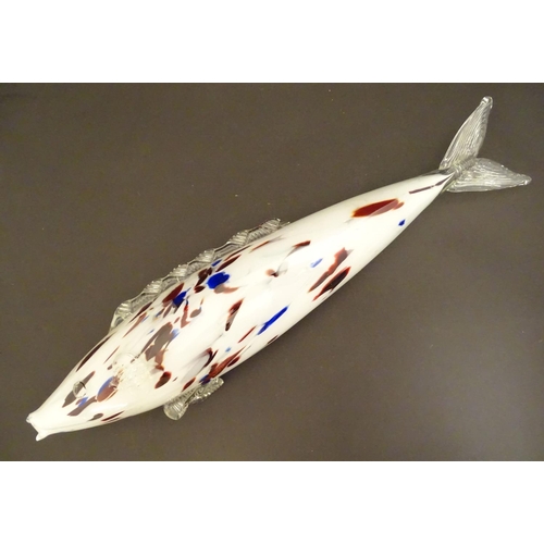 192 - A Murano glass model of a fish, decorated in white with red and blue flecks. 18 1/4