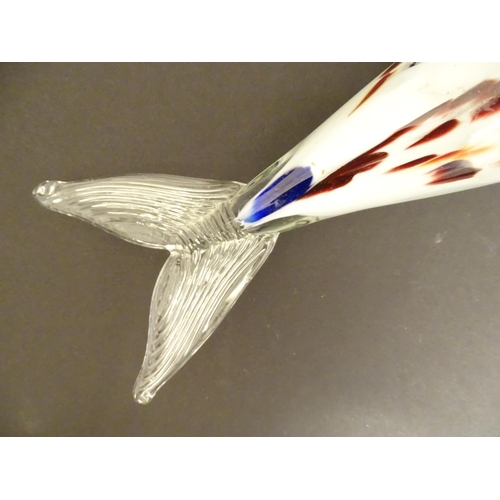192 - A Murano glass model of a fish, decorated in white with red and blue flecks. 18 1/4