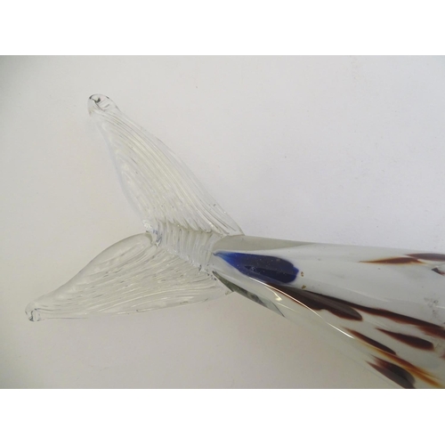 192 - A Murano glass model of a fish, decorated in white with red and blue flecks. 18 1/4