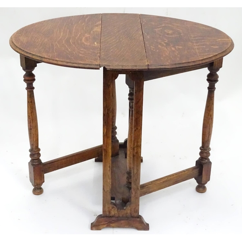 188 - A small oak Sutherland gateleg table. Approx. 19