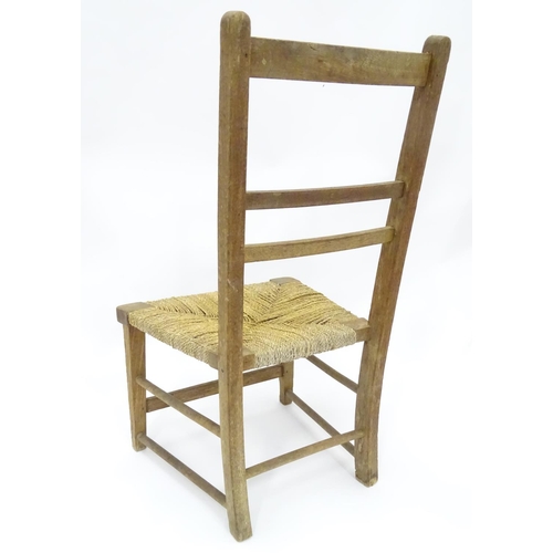 204 - A Victorian fire screen with decoupage horse / equestrian decoration, together with a low chair. The... 