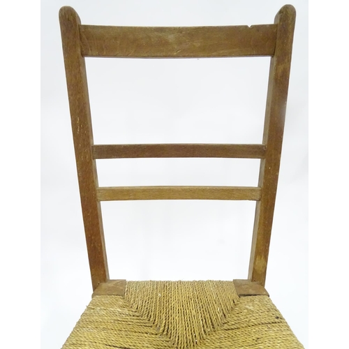 204 - A Victorian fire screen with decoupage horse / equestrian decoration, together with a low chair. The... 