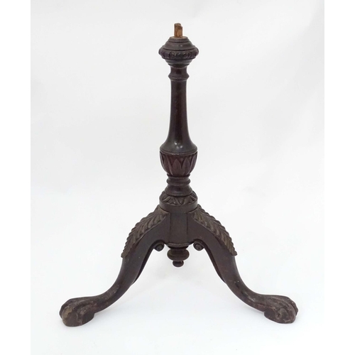 207 - A 19thC mahogany carved wine table base with ball and claw feet. Approx. 22