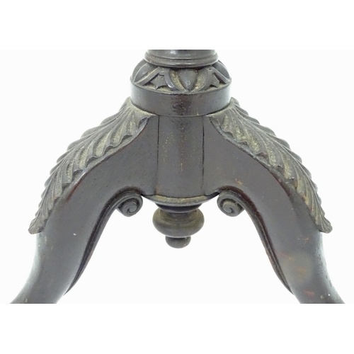 207 - A 19thC mahogany carved wine table base with ball and claw feet. Approx. 22