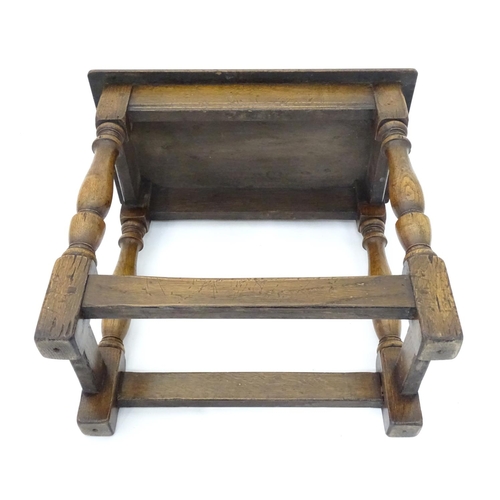 209 - A small mid 20thC peg jointed oak stool. Approx. 18