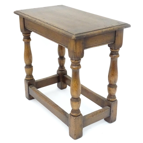 209 - A small mid 20thC peg jointed oak stool. Approx. 18