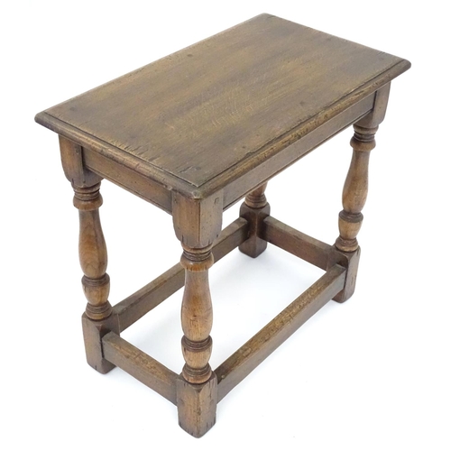 209 - A small mid 20thC peg jointed oak stool. Approx. 18