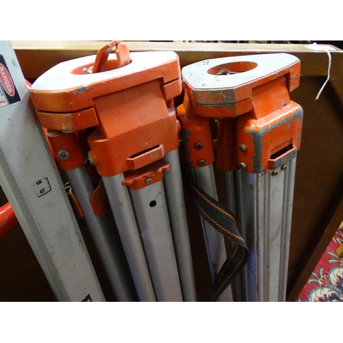 221 - Surveyor's equipment, to include tripods, a trolley, etc.