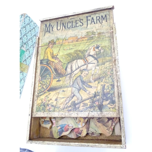 229 - An assortment of early 20thC children's games, puzzles etc.