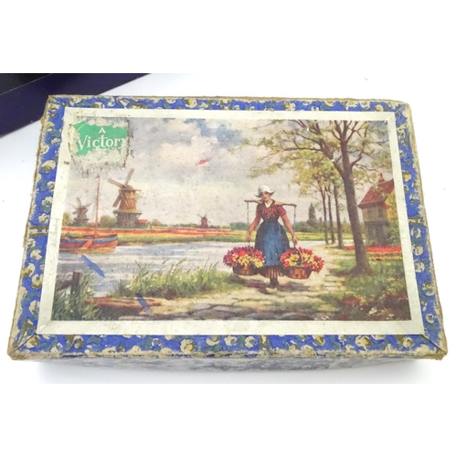 229 - An assortment of early 20thC children's games, puzzles etc.