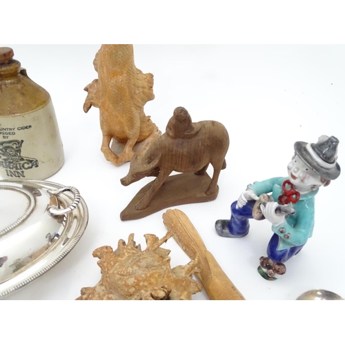 231 - A box of miscellaneous items to include ceramics, metalware, carved wooden items etc.