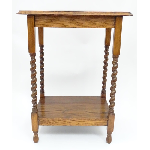 232 - An early 20thC oak side table. Approx. 33 1/2
