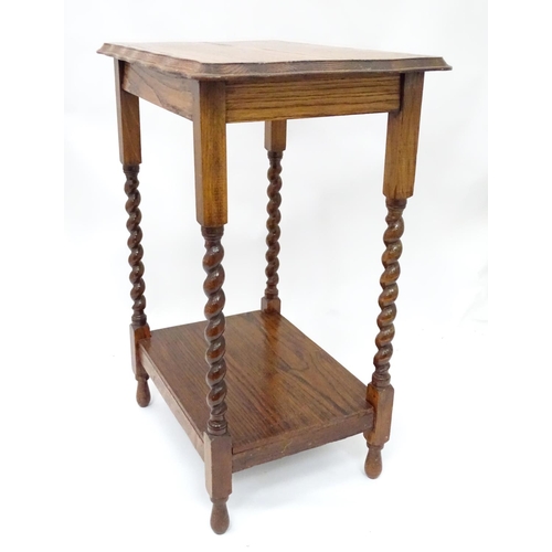 232 - An early 20thC oak side table. Approx. 33 1/2