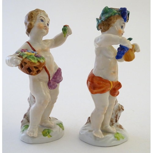 74 - Two Italian putti / cherub figures depicting the seasons Spring and Summer, one with a basket of flo... 