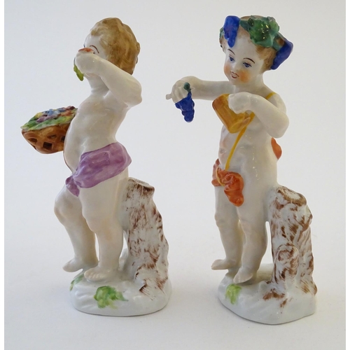 74 - Two Italian putti / cherub figures depicting the seasons Spring and Summer, one with a basket of flo... 