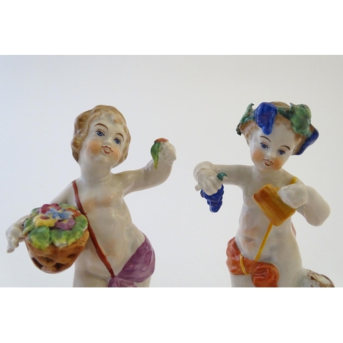 74 - Two Italian putti / cherub figures depicting the seasons Spring and Summer, one with a basket of flo... 