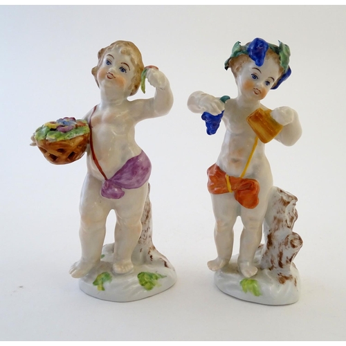 74 - Two Italian putti / cherub figures depicting the seasons Spring and Summer, one with a basket of flo... 