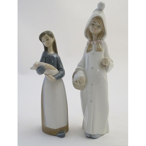 102 - Two Lladro figures to include a girl holding a piglet Girl with Pig, model no. 1011, and Girl with B... 