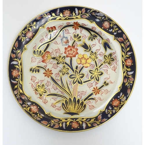 108 - A Copeland plate decorated with flower and foliage with a bird in a cage with cobalt blue and gilt d... 