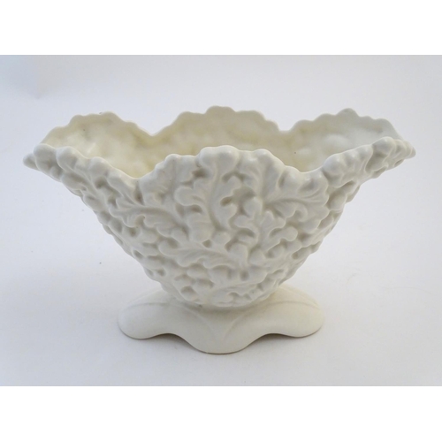 118 - A Sylvac posy holder / vase, the body moulded with a leaf pattern in a white glaze. Approx. 6 1/4