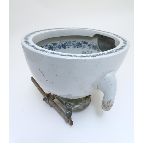 140 - A Victorian water closet bowl / pan with blue and white transfer decoration depicting floral motifs ... 