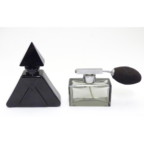 148 - Two Art Deco glass scent bottles, one black glass formed as a pyramid, the other smoked glass with a... 