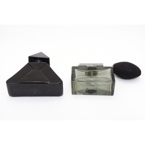 148 - Two Art Deco glass scent bottles, one black glass formed as a pyramid, the other smoked glass with a... 