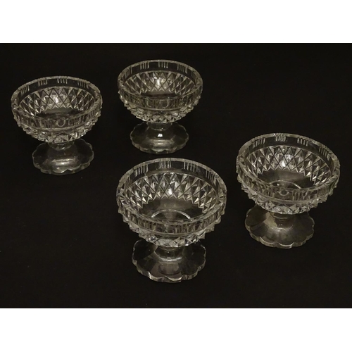 155 - Four Victorian cut glass pedestal table salts, each 2 1/4