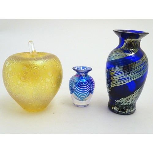 167 - Three items of art glass, comprising a paperweight formed as an apple, and two vases. The largest 5 ... 