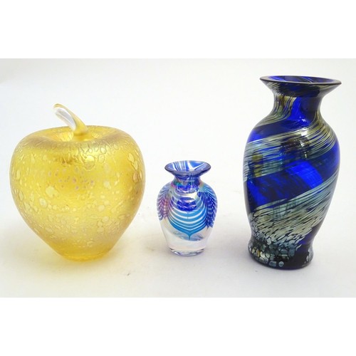 167 - Three items of art glass, comprising a paperweight formed as an apple, and two vases. The largest 5 ... 