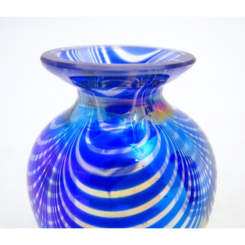 167 - Three items of art glass, comprising a paperweight formed as an apple, and two vases. The largest 5 ... 